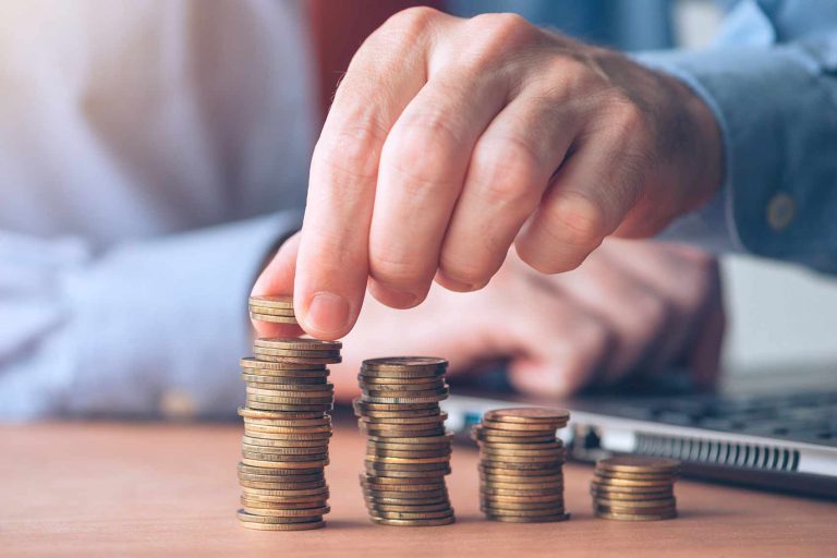photo of hand moving across money